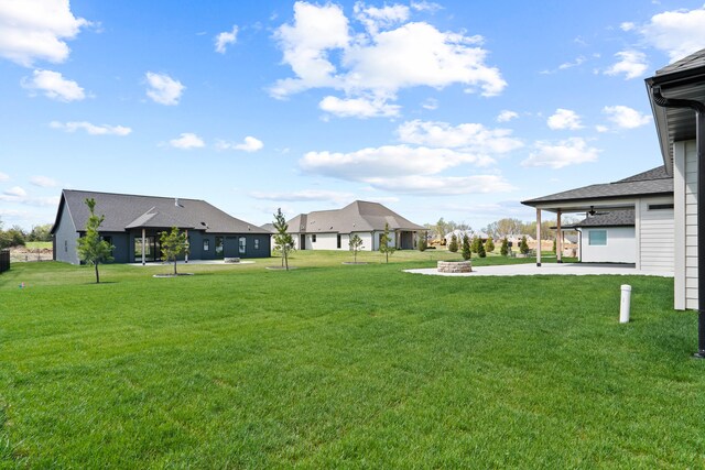 6504 Walsby Dr, Columbia, MO 65201 - view of yard featuring a fire pit and a patio area