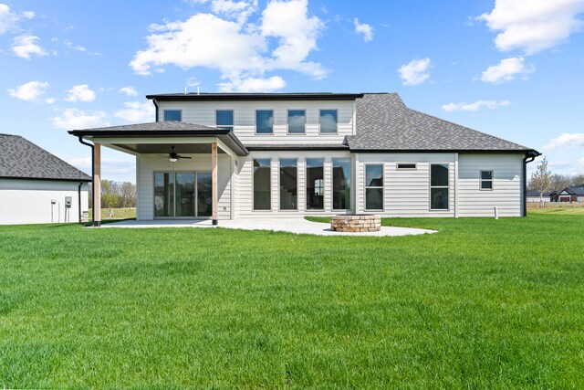 6504 Walsby Dr, Columbia, MO 65201 - back of house featuring a patio area, a shingled roof, ceiling fan, a yard, and an outdoor fire pit