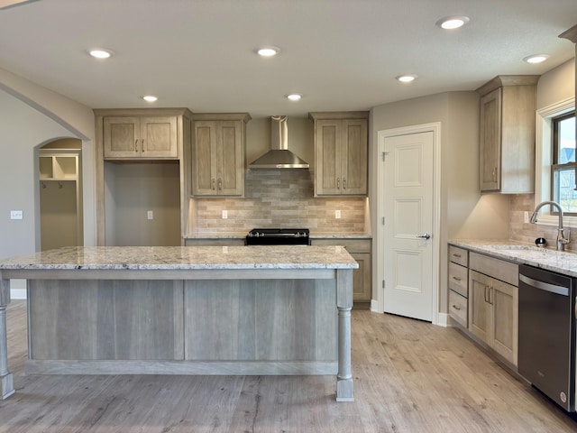 kitchen featuring range, dishwasher, wall chimney exhaust hood, and light stone countertops