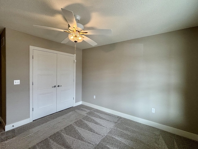 unfurnished bedroom featuring a textured ceiling, ceiling fan, a closet, and baseboards