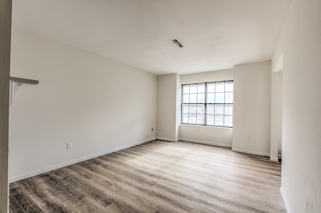 unfurnished room featuring light hardwood / wood-style flooring