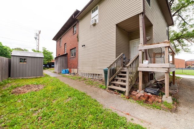 view of home's exterior with a storage shed