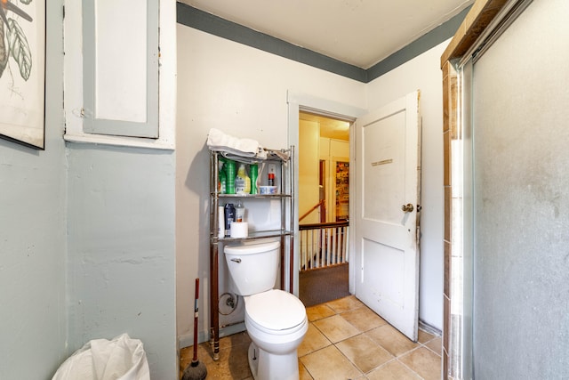 bathroom with tile patterned floors and toilet