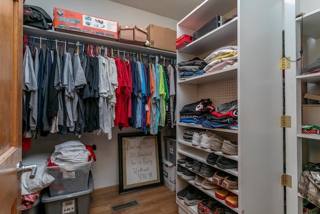 walk in closet featuring light wood-type flooring