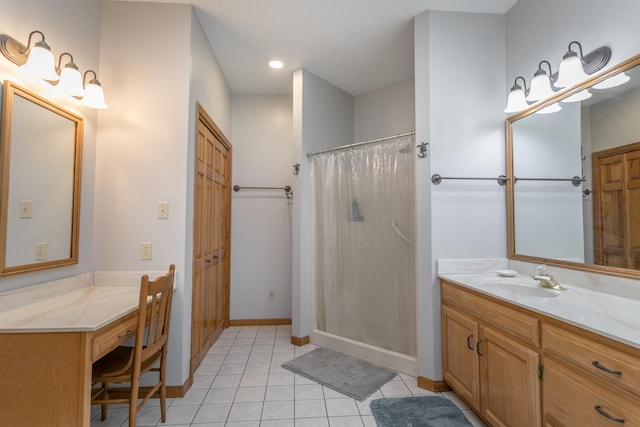 bathroom with a shower with curtain, vanity, and tile patterned flooring