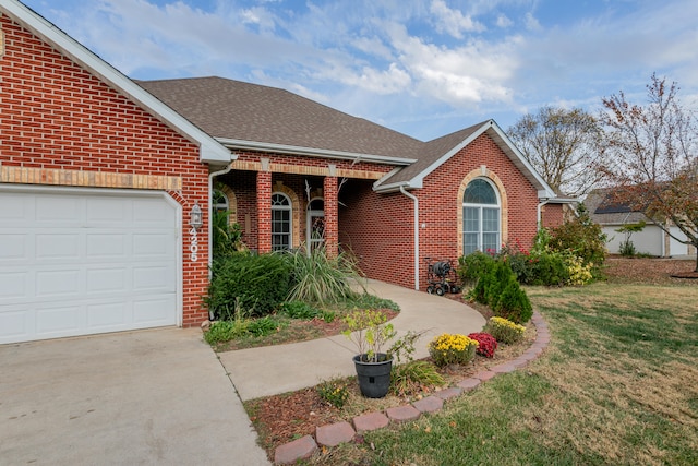 single story home with a front lawn and a garage