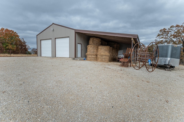 view of outbuilding featuring a garage