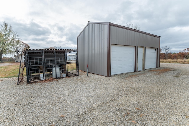 view of outdoor structure with a garage