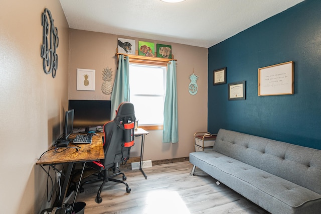 office space with light hardwood / wood-style flooring