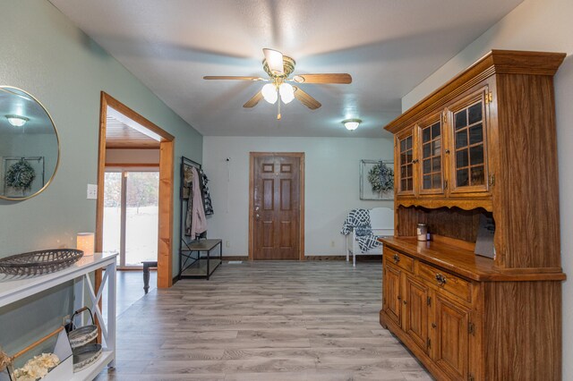 kitchen featuring ceiling fan and light hardwood / wood-style flooring