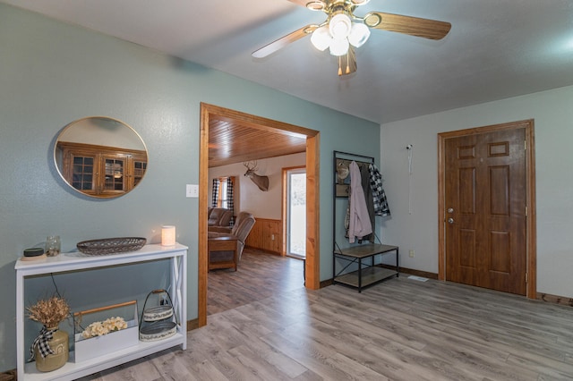 entrance foyer with ceiling fan and light hardwood / wood-style flooring