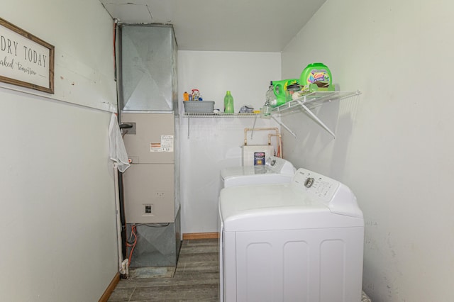 washroom featuring dark wood-type flooring and independent washer and dryer