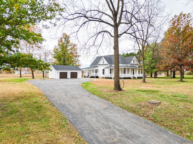 231 State Route W, Fayette, MO 65248 - view of front of home featuring a porch, an outdoor structure, a front lawn, and asphalt driveway
