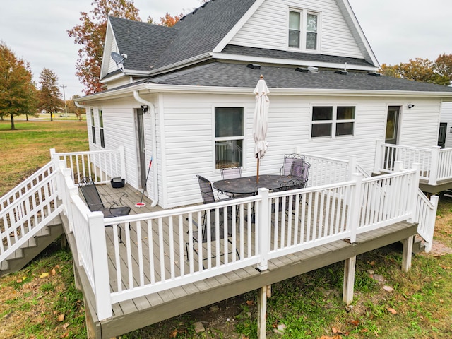 rear view of house featuring a deck