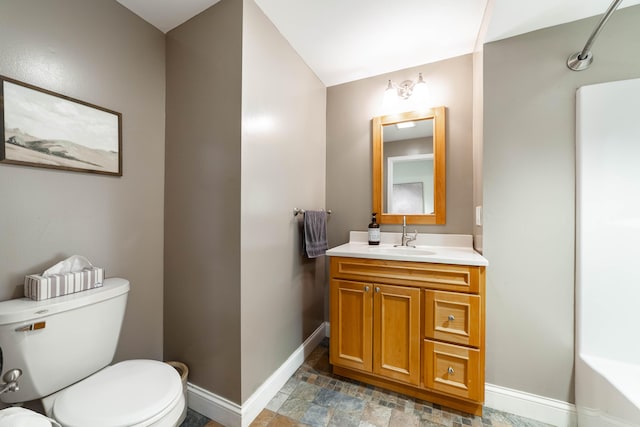 bathroom with toilet and vanity