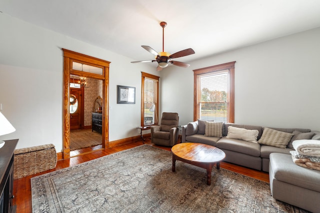 living room featuring dark hardwood / wood-style flooring and ceiling fan