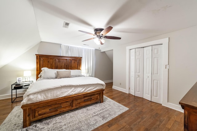 bedroom featuring a closet, lofted ceiling, ceiling fan, and dark hardwood / wood-style floors