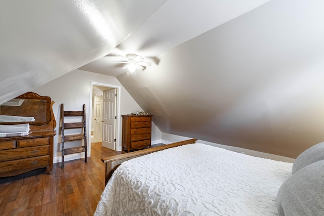 bedroom featuring lofted ceiling, ceiling fan, and wood-type flooring