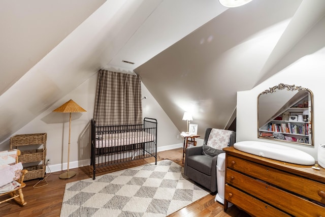 231 State Route W, Fayette, MO 65248 - bedroom with lofted ceiling, wood finished floors, and baseboards