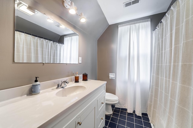 231 State Route W, Fayette, MO 65248 - full bath featuring vaulted ceiling, plenty of natural light, tile patterned flooring, vanity, and toilet