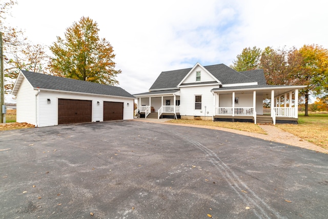 view of front of property featuring a porch and a garage