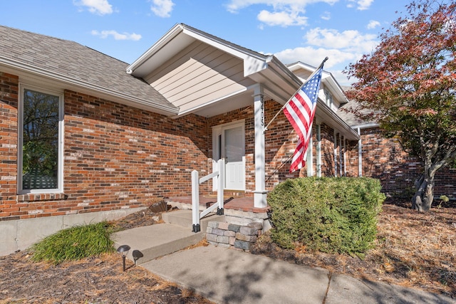 3405 Woodrail Ter, Columbia, MO 65203 - view of exterior entry featuring brick siding and a shingled roof