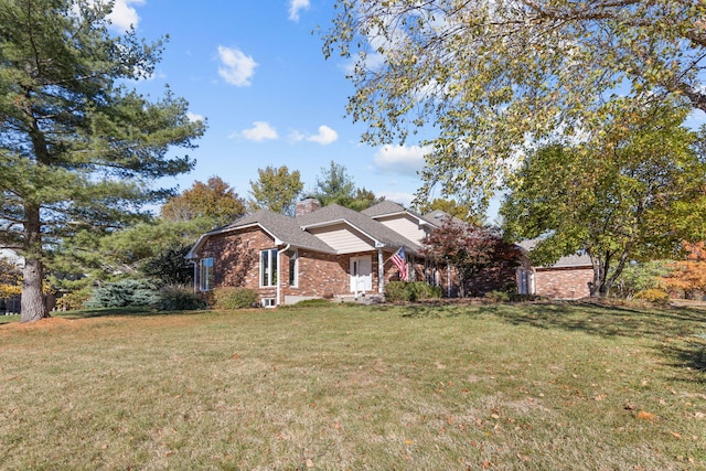 3405 Woodrail Ter, Columbia, MO 65203 - view of front of property featuring brick siding, a front yard, and a chimney