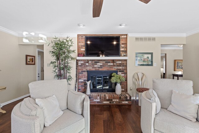 3405 Woodrail Ter, Columbia, MO 65203 - living room with ceiling fan, ornamental molding, a brick fireplace, wood finished floors, and baseboards
