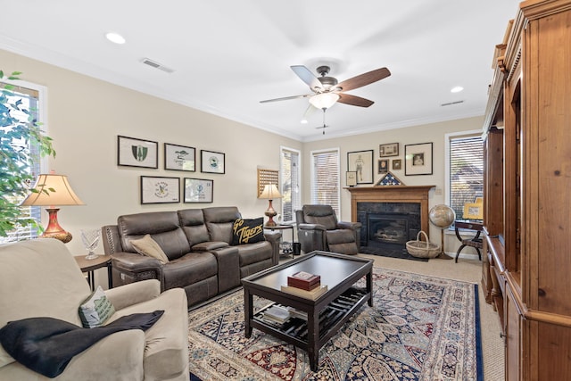 3405 Woodrail Ter, Columbia, MO 65203 - carpeted living room with a ceiling fan, ornamental molding, a fireplace, and recessed lighting