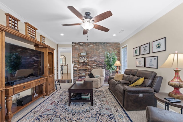 living room with ceiling fan and ornamental molding