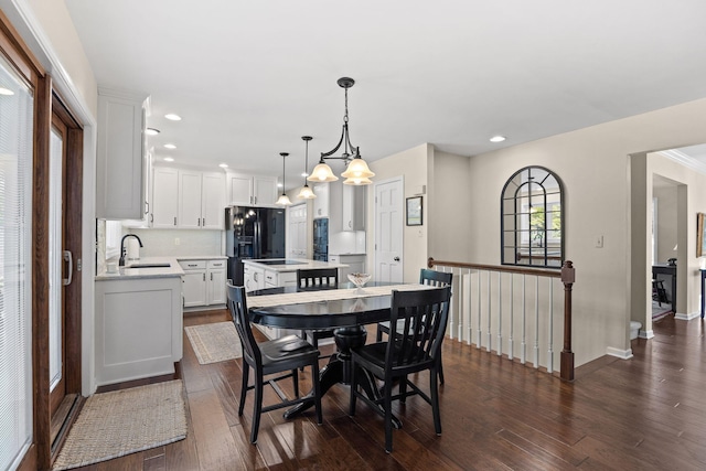 3405 Woodrail Ter, Columbia, MO 65203 - dining space featuring dark wood finished floors, recessed lighting, baseboards, and a chandelier