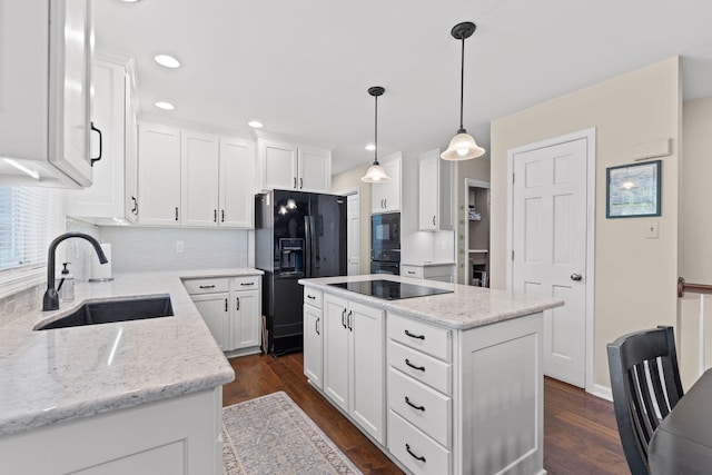 3405 Woodrail Ter, Columbia, MO 65203 - kitchen with a sink, black appliances, a kitchen island, white cabinets, and dark wood-style flooring