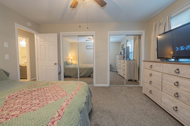 bedroom with ceiling fan, multiple windows, multiple closets, and carpet