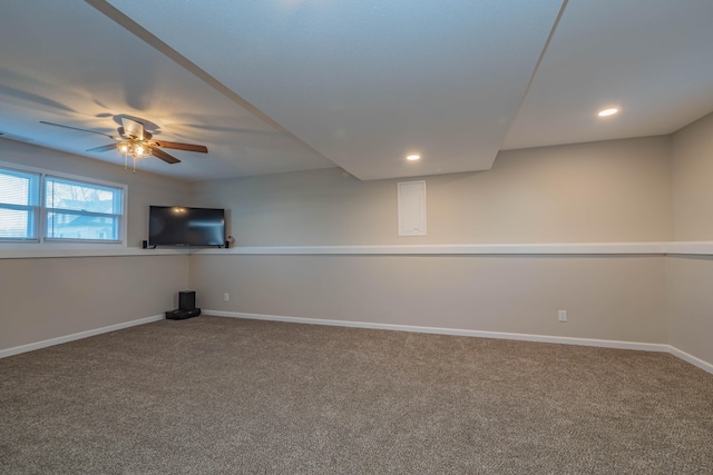 basement featuring carpet flooring and ceiling fan