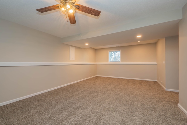 basement with carpet and ceiling fan