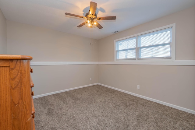 unfurnished room with carpet floors and ceiling fan