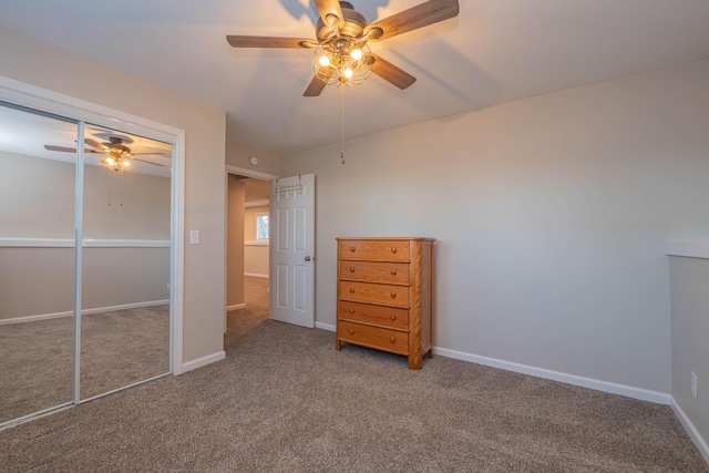 unfurnished bedroom featuring carpet, ceiling fan, and a closet