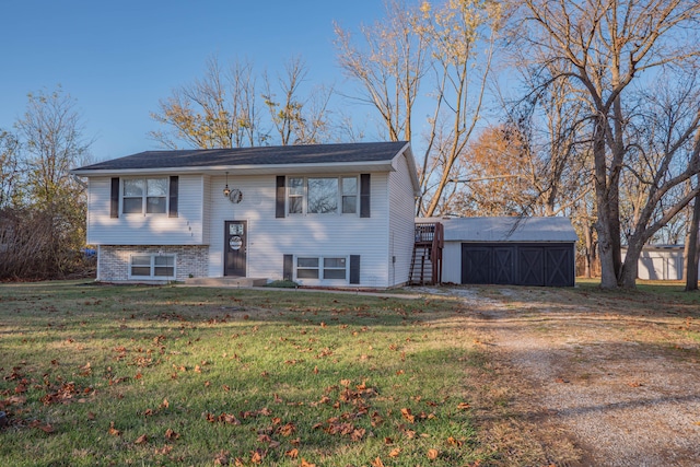 split foyer home with a front yard and an outdoor structure