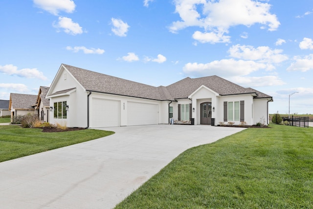 view of front of house featuring a garage and a front yard