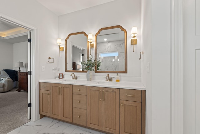 bathroom with walk in shower and vanity