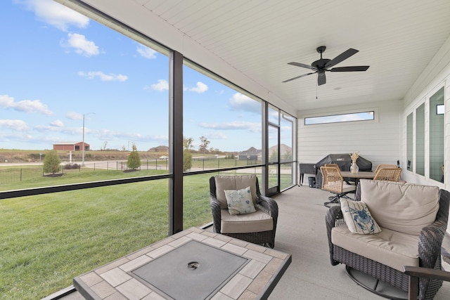 sunroom / solarium with ceiling fan