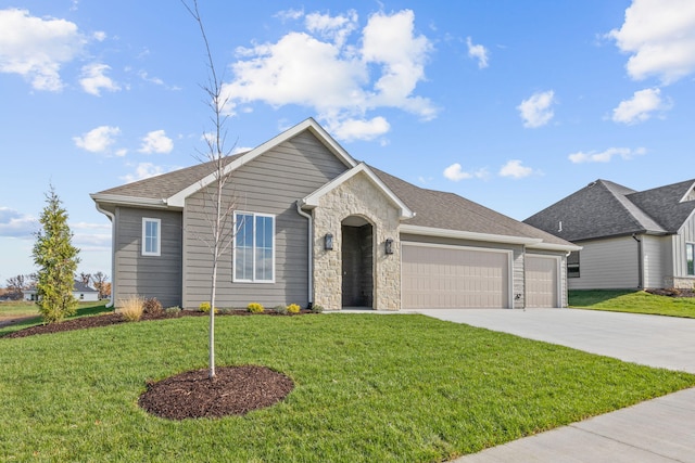 LOT523 The Brks, Columbia, MO 65201 - ranch-style house featuring an attached garage, driveway, a front lawn, and stone siding