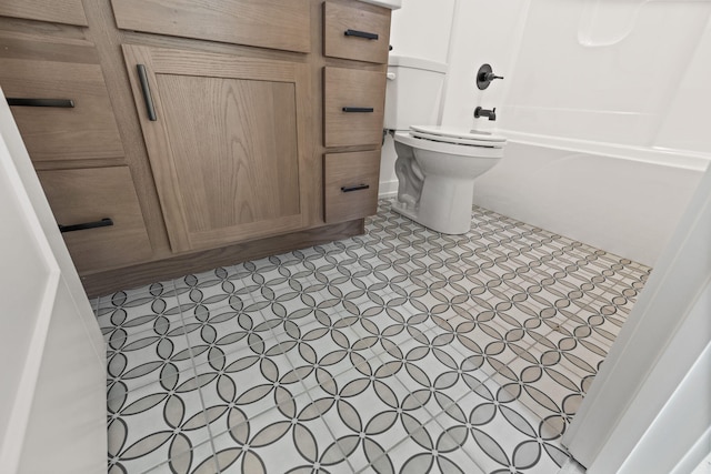 bathroom featuring toilet and shower / bathing tub combination