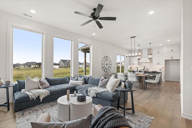 LOT523 The Brks, Columbia, MO 65201 - living area featuring light wood-style floors, recessed lighting, ceiling fan, and baseboards