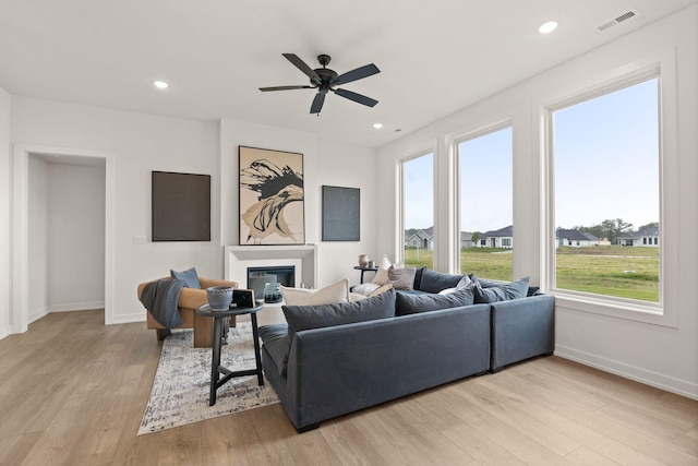 LOT523 The Brks, Columbia, MO 65201 - living room featuring baseboards, a glass covered fireplace, light wood-style floors, ceiling fan, and recessed lighting
