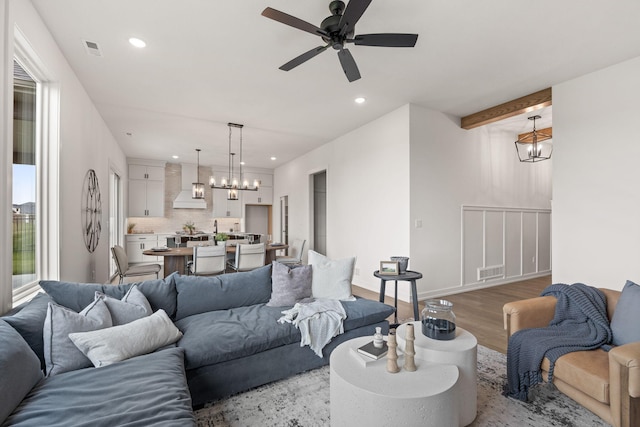 LOT523 The Brks, Columbia, MO 65201 - living room with a chandelier, ceiling fan, wood finished floors, and recessed lighting
