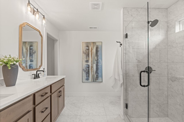 LOT523 The Brks, Columbia, MO 65201 - bathroom with double vanity, a shower stall, baseboards, and marble finish floors