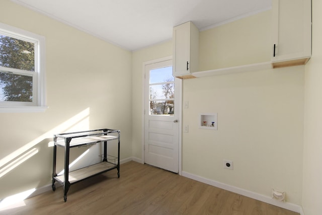 washroom featuring washer hookup, hookup for an electric dryer, hardwood / wood-style flooring, and plenty of natural light