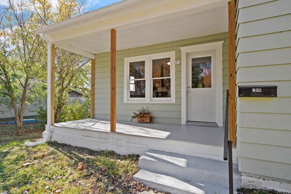 201 N Evans St, Armstrong, MO 65230 - doorway to property featuring covered porch