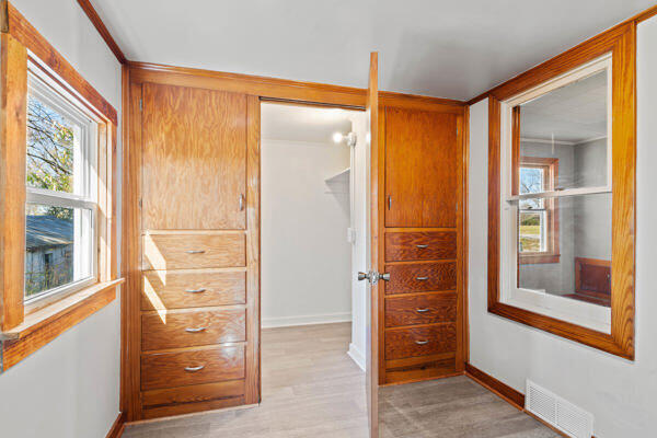 201 N Evans St, Armstrong, MO 65230 - hallway with plenty of natural light, baseboards, and light wood-type flooring